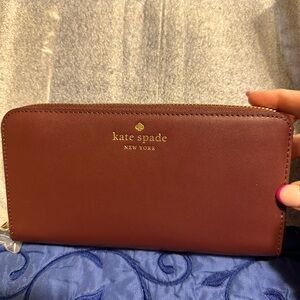 Kate Spade large continental wallet. Cherry wood in color. NWT